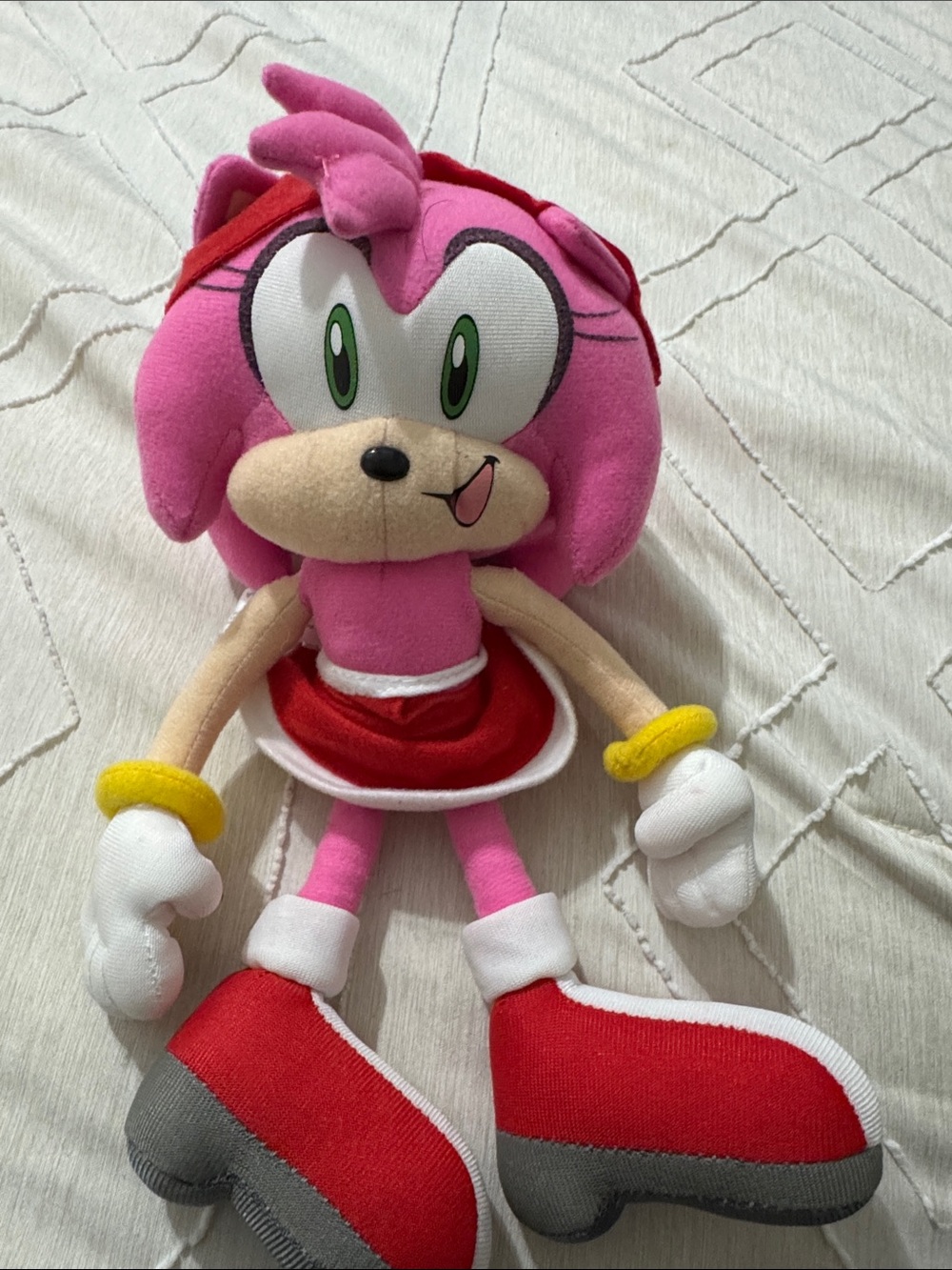 Pink Plush Character Doll with Red Dress and Green Eyes